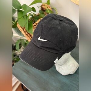 Nike Black hat with white logo on side. One size